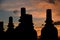 Hindu temple ruin silhouette at sunrise with colorful sky at Prambanan, Indonesia