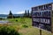 Hindu temple ruins of Pura Hulun Danu with caution board sign do not litter at the Tamblingan lake, Bali, Indonesia