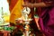 Hindu wedding rituals Traditional south Indian brass oil lamp with people