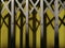 Hinged Steel vintage door in yellow and Grey. Shadow and background can use as banner.