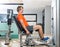 Hip abduction blond man exercise at gym closing