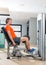 Hip abduction blond man exercise at gym closing