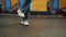 Hip hop street dance feet dance on background of graffiti, gimbal pan shot