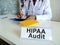 HIPAA audit concept. Doctor works with medical documents.