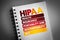 HIPAA - Health Insurance Portability and Accountability Act acronym on notepad, concept background