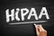 HIPAA - Health Insurance Portability and Accountability Act acronym, text concept on blackboard