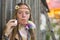 Hippie beautiful girl blows bubbles. Outdoors.