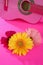 Hippie flower yellow pink gerbera on guitar