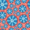 Hippie flowers. Flower power seamless vector background. Blue and red abstract flowers on a pink background. Retro floral 1970s