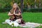 Hippie girl meditation yoga in the park  vintage rabbit pet