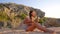 Hippie girl sitting on sandy beach and playing ukulele guitar. HD slowmotion.