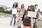 Hippie Group Hitchhiking on a Countryside Road