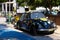 Hippie Highway: A Sunny Day Encounter with a Flower-Painted Vintage Volkswagen Beetle in Matala