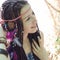 Hippie style young woman with dreadlocks portrait, outdoor