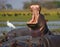 Hippo is sitting in the water, opening his mouth and yawning. Botswana. Okavango Delta.