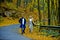 Hipster autumn fashion couple having fun on walking, Happy people travel lifestyle concept, full length. Autumnal