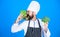 Hipster chief chef vegan cafe. Health and dieting. I choose vegan lifestyle. Man cook hat apron hold broccoli and