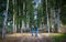 Hipster couple in the birch wood