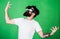 Hipster on enthusiastic face having fun in virtual reality. Virtual party concept. Guy with head mounted display dance