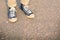 Hipster feet a man and jeans sneaker in nature