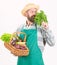 Hipster gardener wear apron carry vegetables. Man bearded presenting vegetables white background isolated. Farmer straw