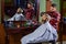 Hipster getting haircut. Man with dyed hair. Barber hairstyle barbershop. Barber cosmetics. Hairdresser tools. Barber