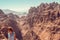 Hipster girl enjoy vacation and journey to Jordan. Gorgeous view from Petra. Negative space for text. Tourism industry. Active lif