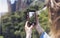 Hipster girl making photo on smartphone mobile closeup, view tourist hands using gadget phone in travel on background mountains