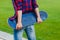 Hipster girl on rural road holding a skateboard in hands