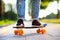 Hipster girl with skateboard outdoors. Closeup skateboarding