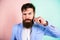 Hipster handsome attractive guy with long beard. Ultimate moustache grooming guide. Expert tips for growing and