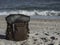 Hipster hiker tourister khaki backpack close up on background blue sea ocean horizon on sand beach, blurred panoramic seascape