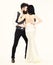 Hipster with lady dressed up for wedding ceremony. Couple in love, bride and groom in elegant clothes, white background