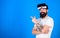 Hipster with long beard enjoying cyber space gaming, virtual reality concept. Cool man with trendy beard and confident
