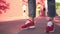 A hipster man in sports shoes on the background of a basketball court.