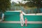 Hipster mom in straw hat with daughter barefoot. Film style