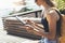 Hipster person holding in hands digital tablet with blank screen, girl photograph on computer on background nature summer park