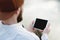 Hipster person holding in hands digital tablet with empty blank screen, man photograph on computer on background nature