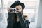 Hipster photographer teen girtl. Stylish casual clothes with hat