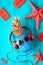 Hipster pineapple character in red sunglasses and earphones listens to the music.  Rustic textured wooden background boards painte