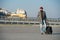 Hipster ready enjoy travel. Carry travel bag. Man bearded hipster travel with luggage bag on wheels. Traveler with