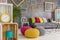 Hipster room with colorful poufs