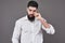 Hipster with serious face. Feeling and emotions. Guy or bearded man on grey background. Barber fashion and beauty. Man