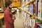 Hipster student picking a book in library