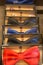 Hipster Style Red, Blanck and Blue Bowties Wrapped in Gift Boxes