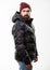 Hipster winter fashion. Comfortable winter outfit. Winter stylish menswear. Man stand warm camouflage pattern jacket