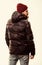 Hipster winter fashion. Guy wear hat and black winter jacket. Comfortable winter outfit. Winter stylish menswear. Man