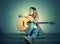 Hipster woman style portrait enjoy with guitar look so happy