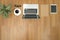 Hipster wooden desktop with laptop, office accessories, flat lay