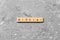 Hipster word written on wood block. Hipster text on cement table for your desing, concept
